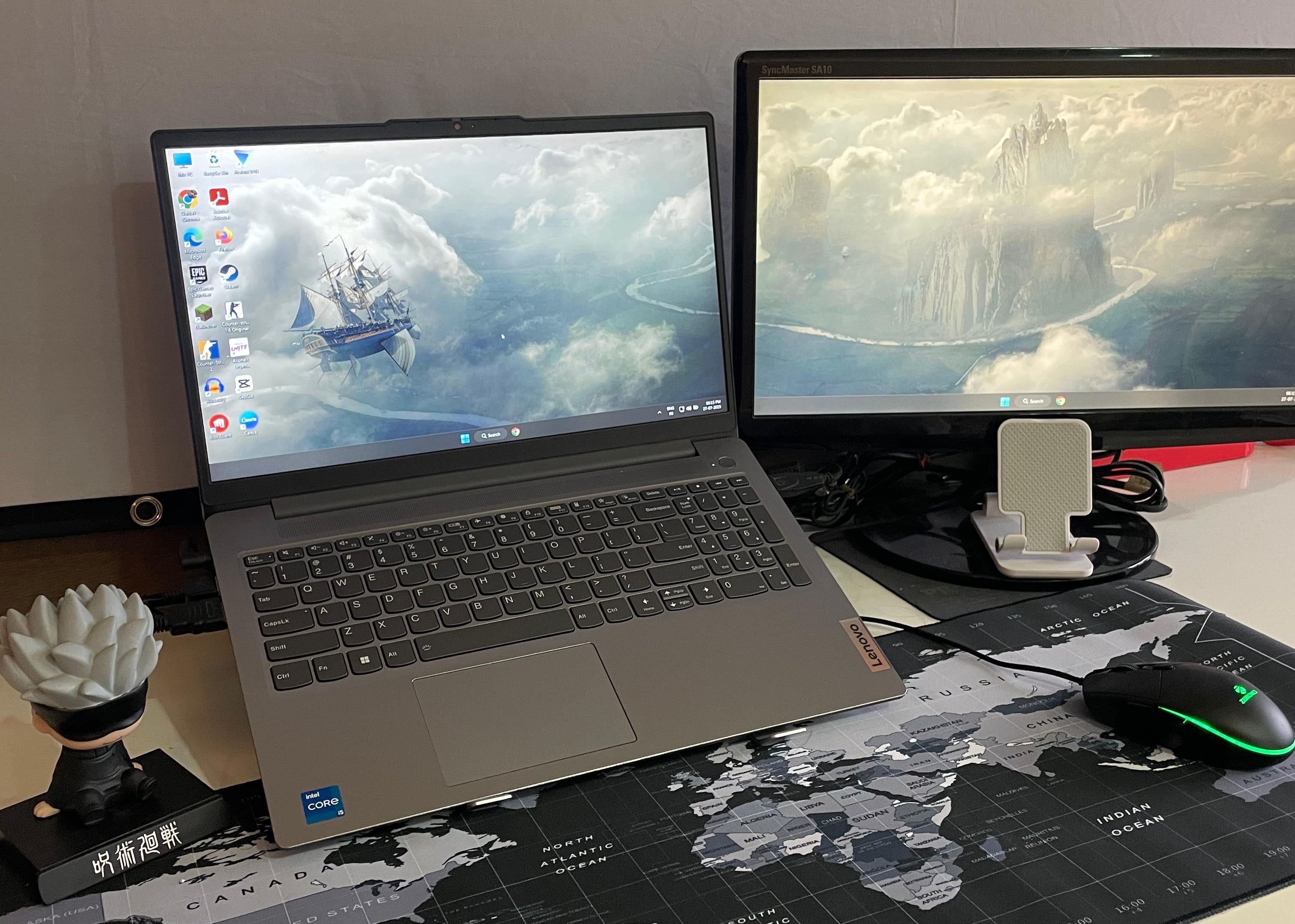 Laptop and monitor setup on a desk with a ShopKaro's White Stand